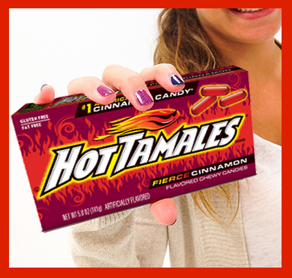Woman holding Hot Tamales candy box
